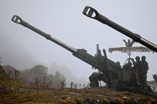 <p>File photo: Indian Army soldiers are pictured on a Bofors gun positioned at Penga Teng Tso ahead of Tawang, near the Line of Actual Control (LAC), neighbouring China</p>