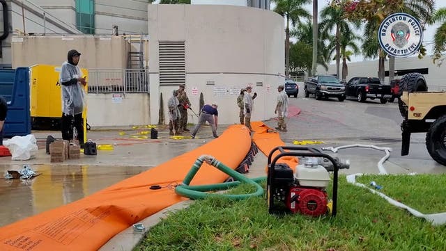<p>A flood barrier being installed around Florida hospital ahead of Hurricane Idalia</p>