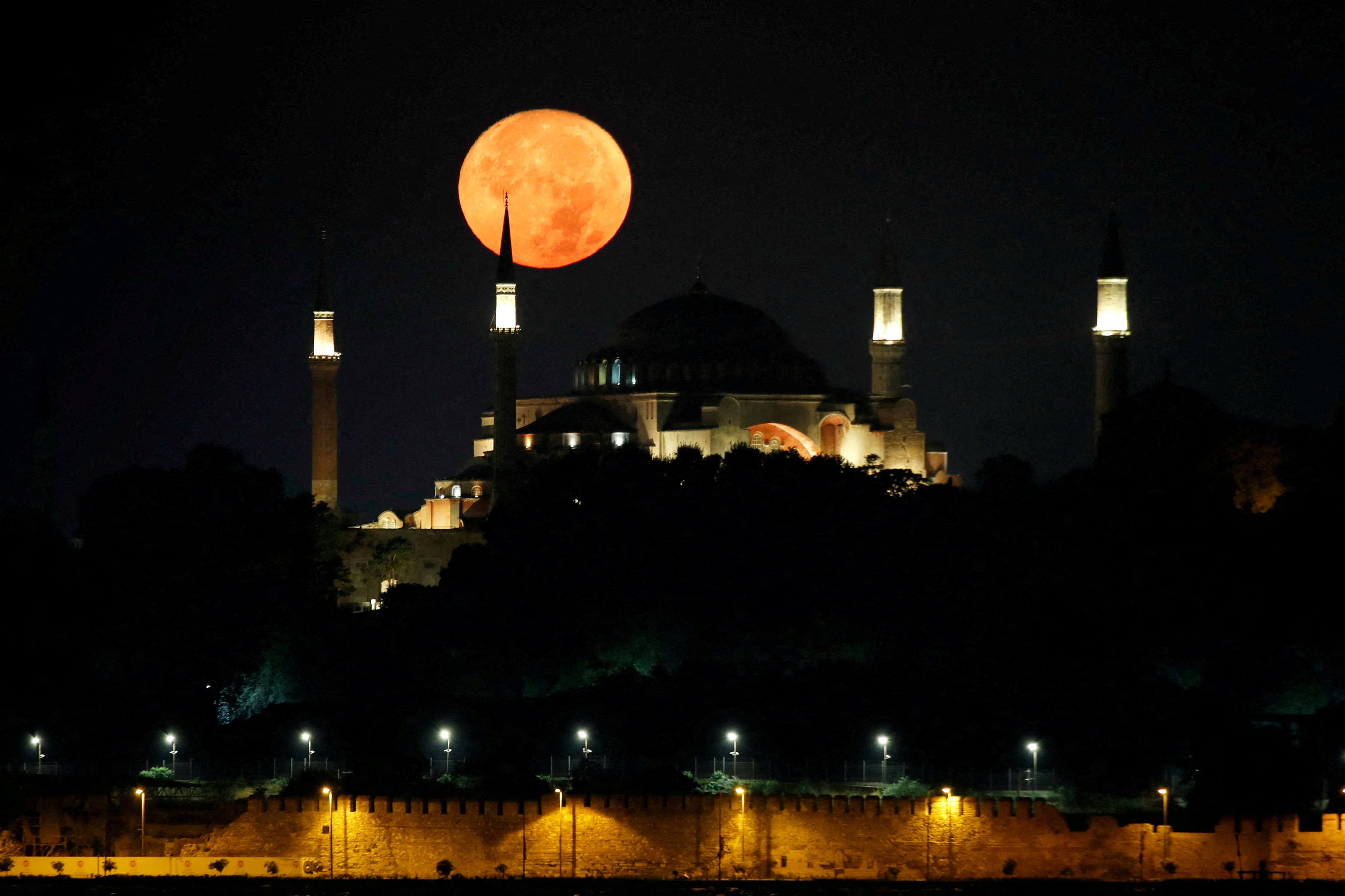 The moon is pictured over the Ayasofya-i Kebir Camii or Hagia Sophia Grand Mosque in Istanbul