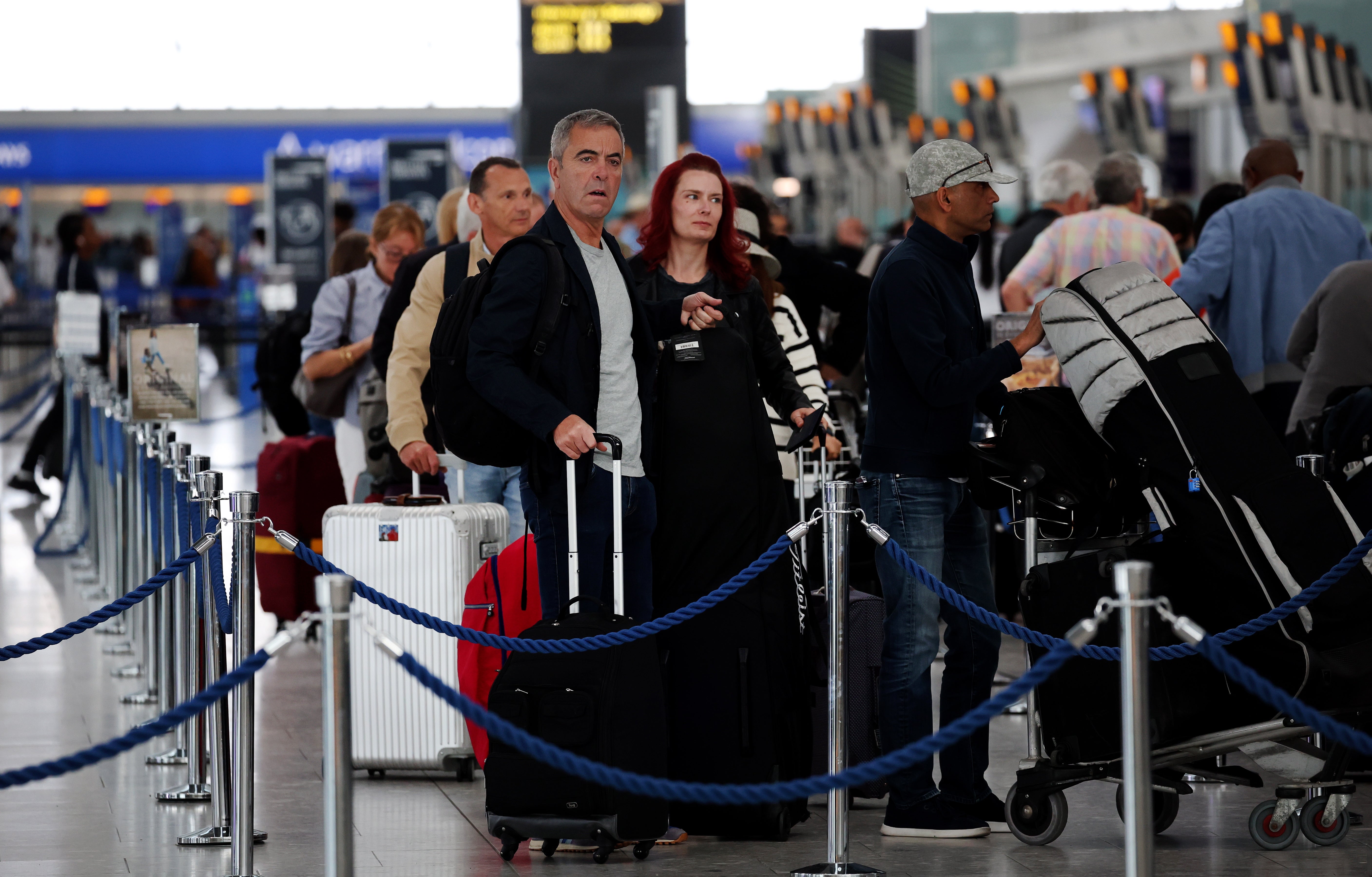 Passengers queue at Heathrow Airport, 30 August 2023