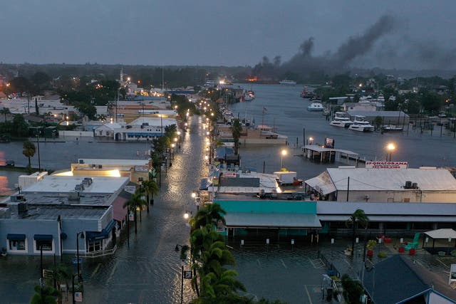 <p>In an aerial view, a fire is seen as flood waters inundate the downtown area after Hurricane Idalia passed offshore on August 30, 2023 in Tarpon Springs, Florida. Hurricane Idalia is hitting the Big Bend area of Florida</p>
