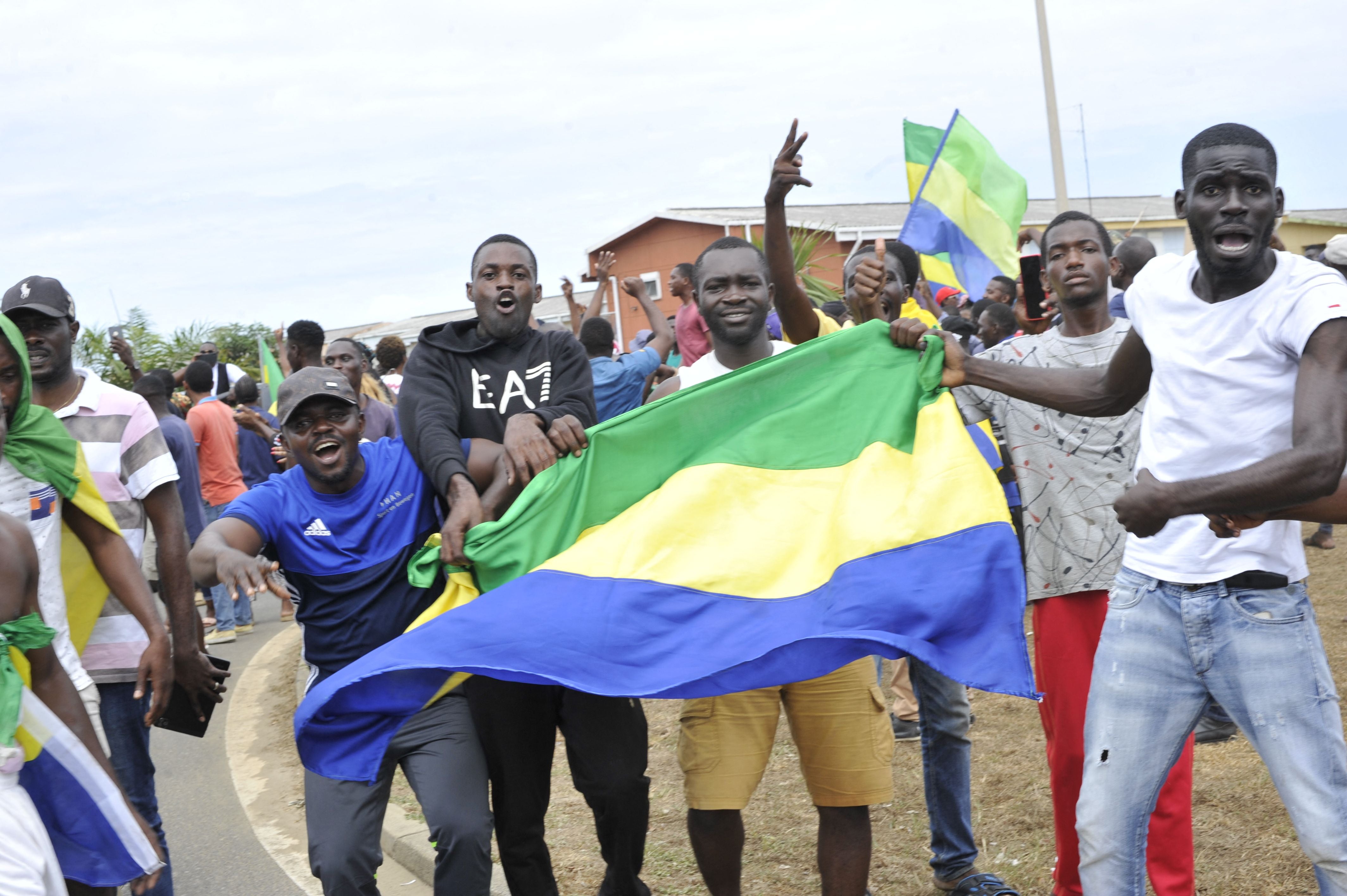 Residents in Libreville celebrate the Gabon coup on Wednesday
