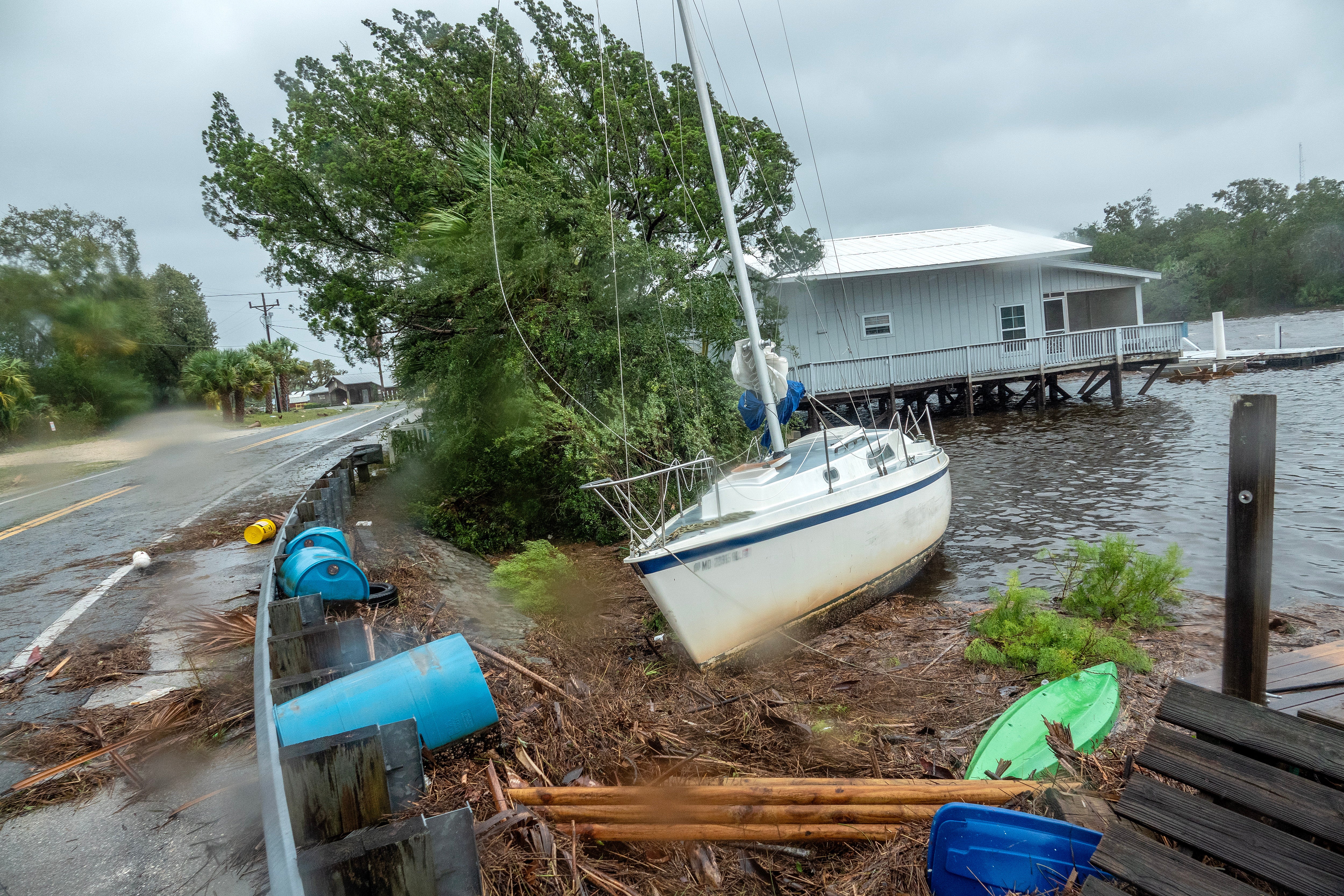 A boat is stranded near to a road in the town of Jena, after Hurricane Idalia made landfall near Keaton Beach, Florida