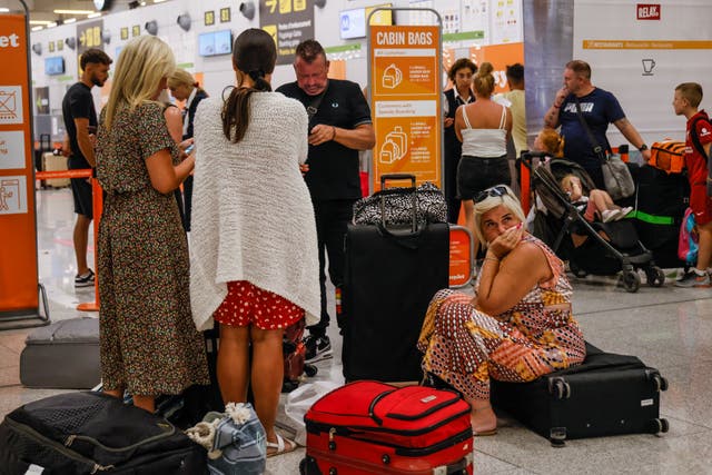 <p>Tourists wait at the airport of Palma for their return flight to Italy d</p>