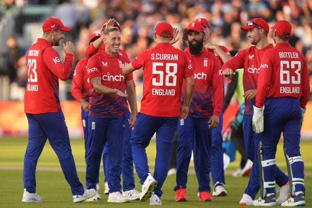 Luke Wood (second left) celebrates taking the wicket of New Zealand’s Glenn Phillips (Owen Humphreys/PA)