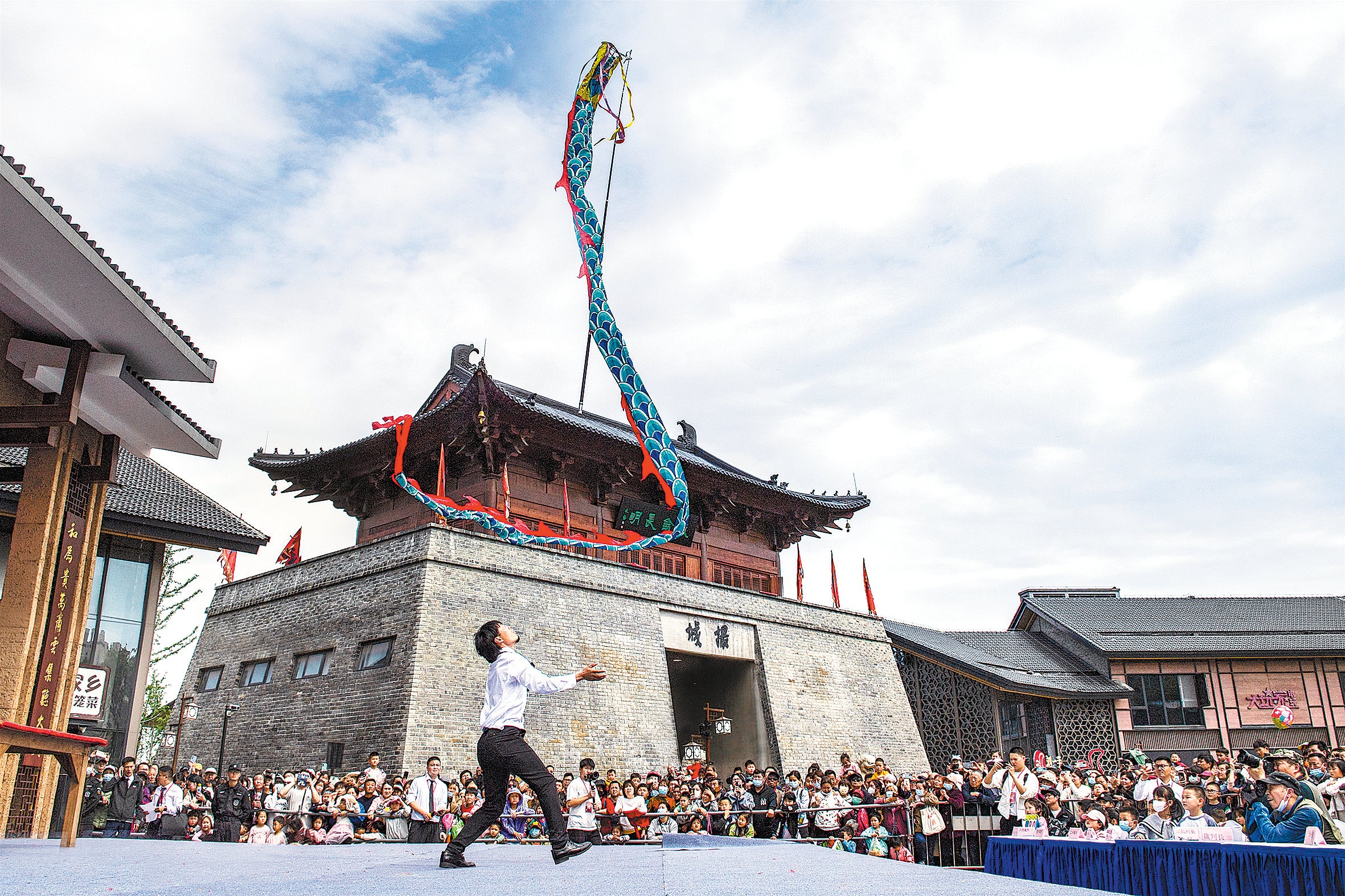 Yang Feilong, a young inheritor of Henan province's Xitao town, performs a flying-dragon dance in Hefei, Anhui province