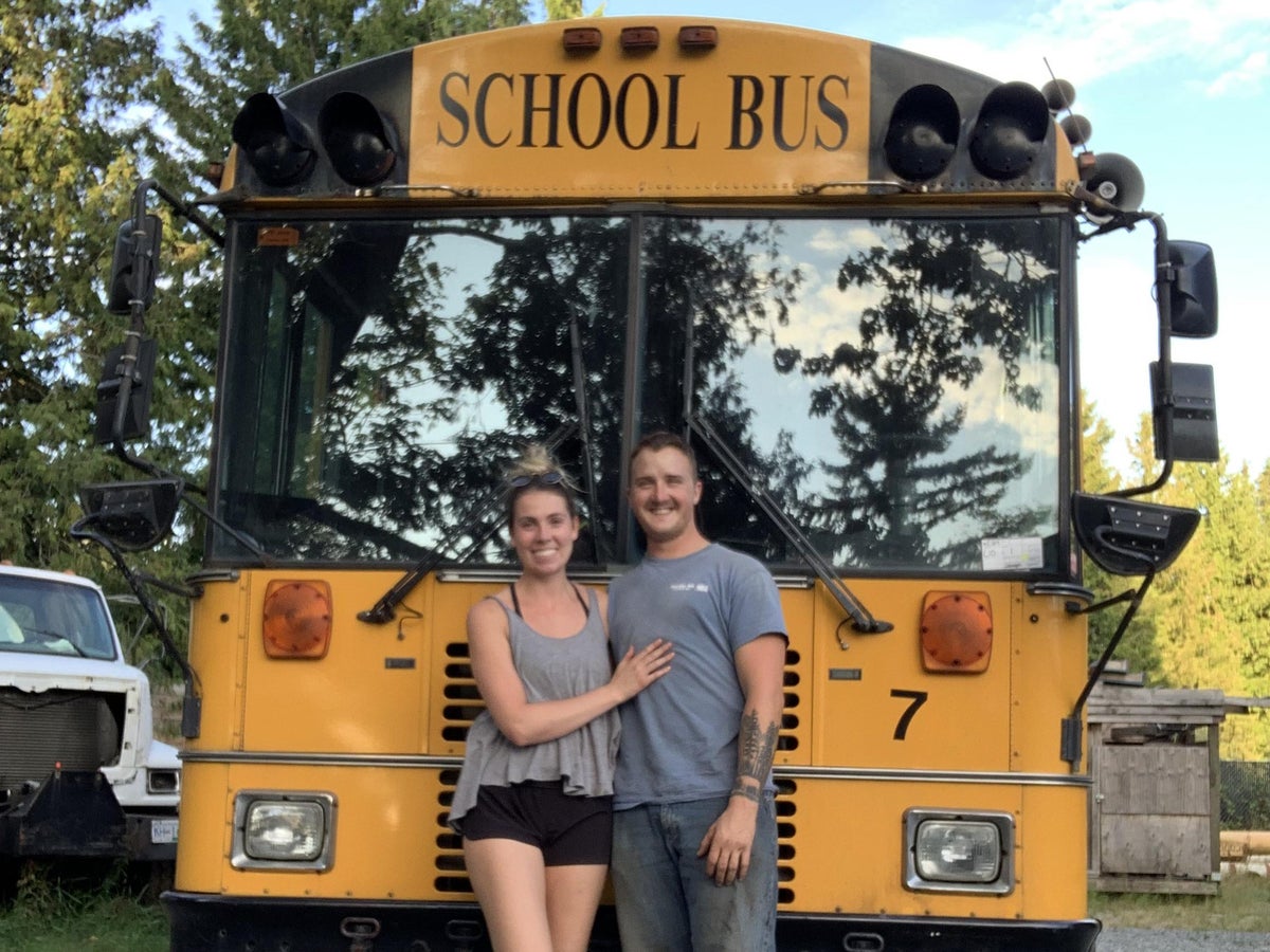 Couple who felt trapped by bills sell everything to live on bus and become influencers