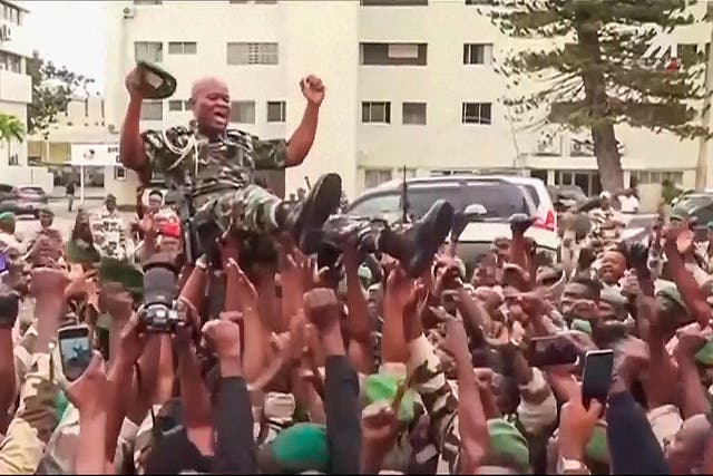 <p>Video grab shows soldiers holding General Brice Clothaire Oligui Nguema, Gabon’s new leader, aloft in capital Libreville</p>