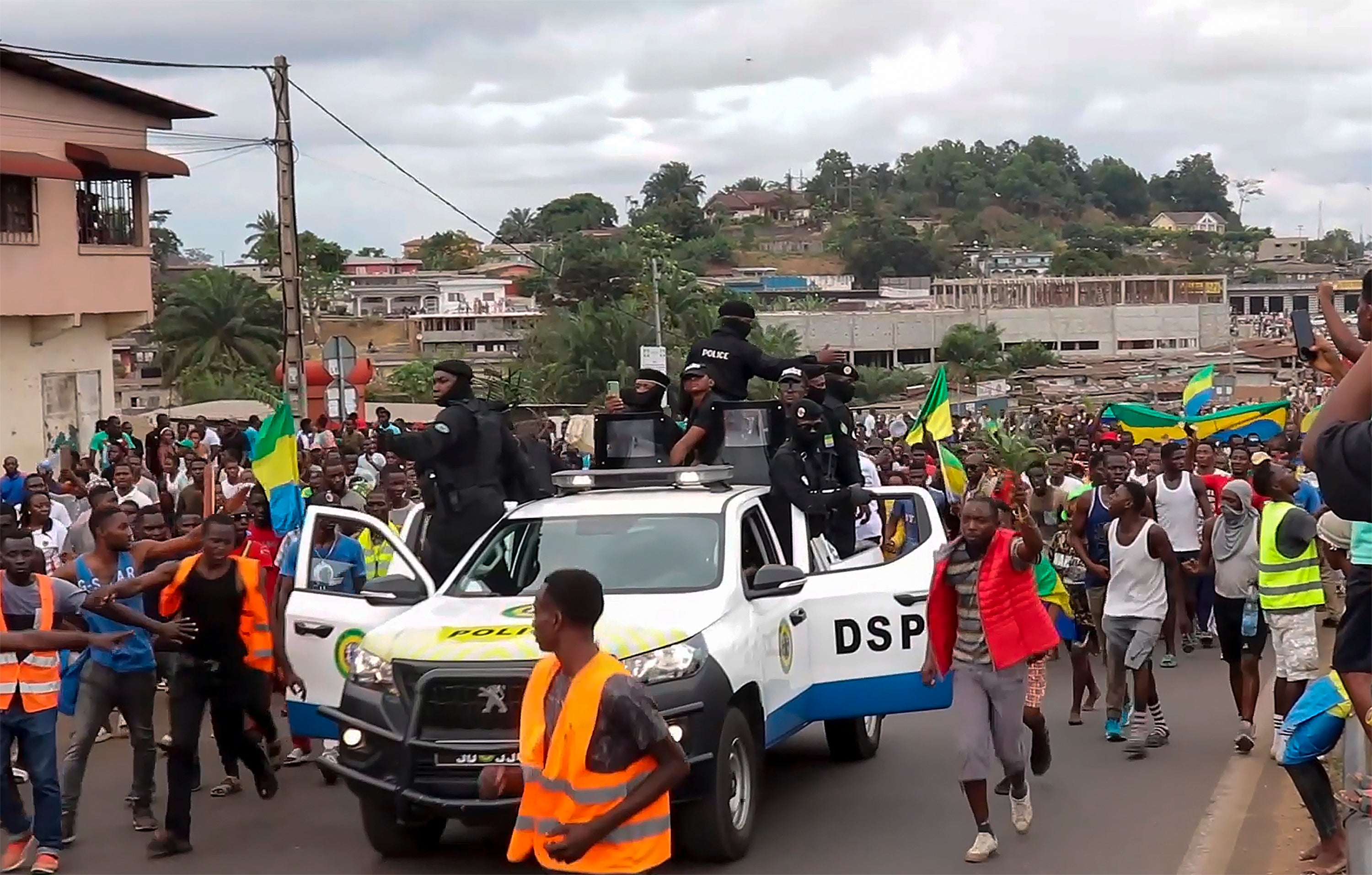 This video grab shows coup supporters cheering police officers in Libreville on 30 August