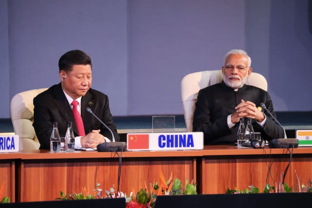 <p>China’s president Xi Jinping and India’s Prime Minister Narendra Modi attend a session meeting during the 10th BRICS summit in 2018 </p>