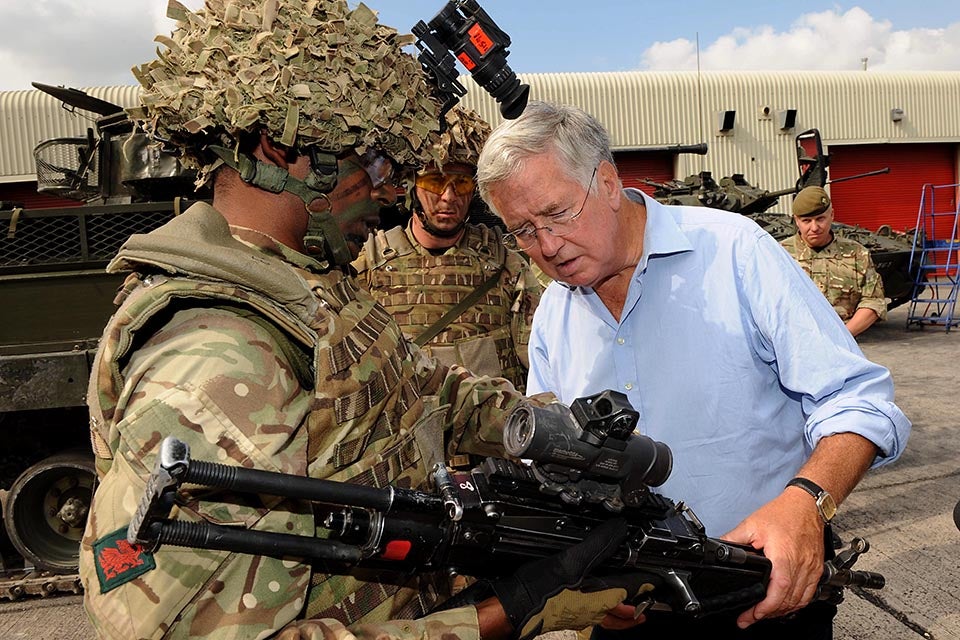 Michael Fallon examining weaponry at Tidworth in 2014