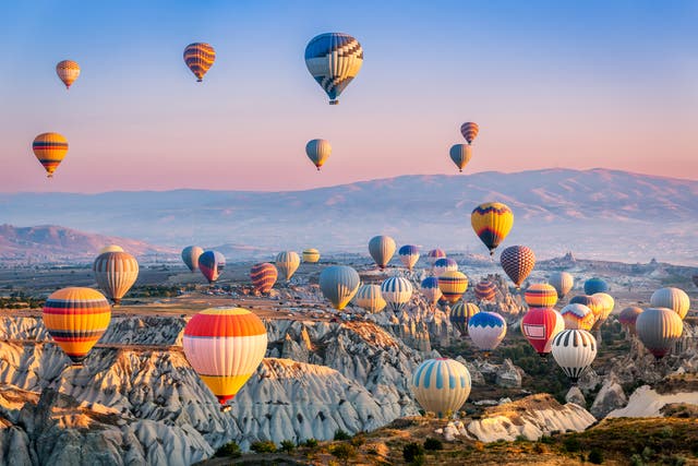 <p>Watching the fleet of hot air balloons is a  Cappadocia favourite </p>