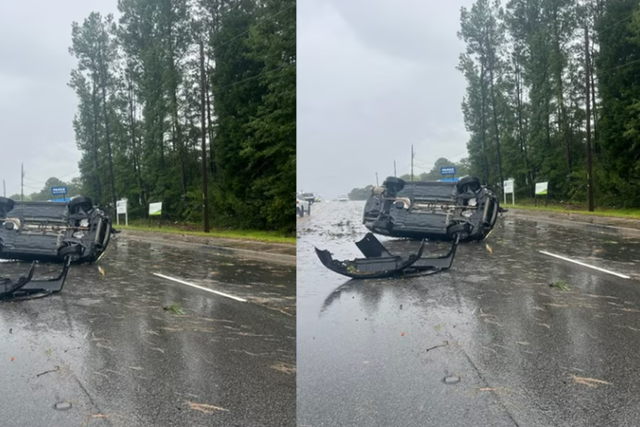 <p>Car flipped up by the storm </p>