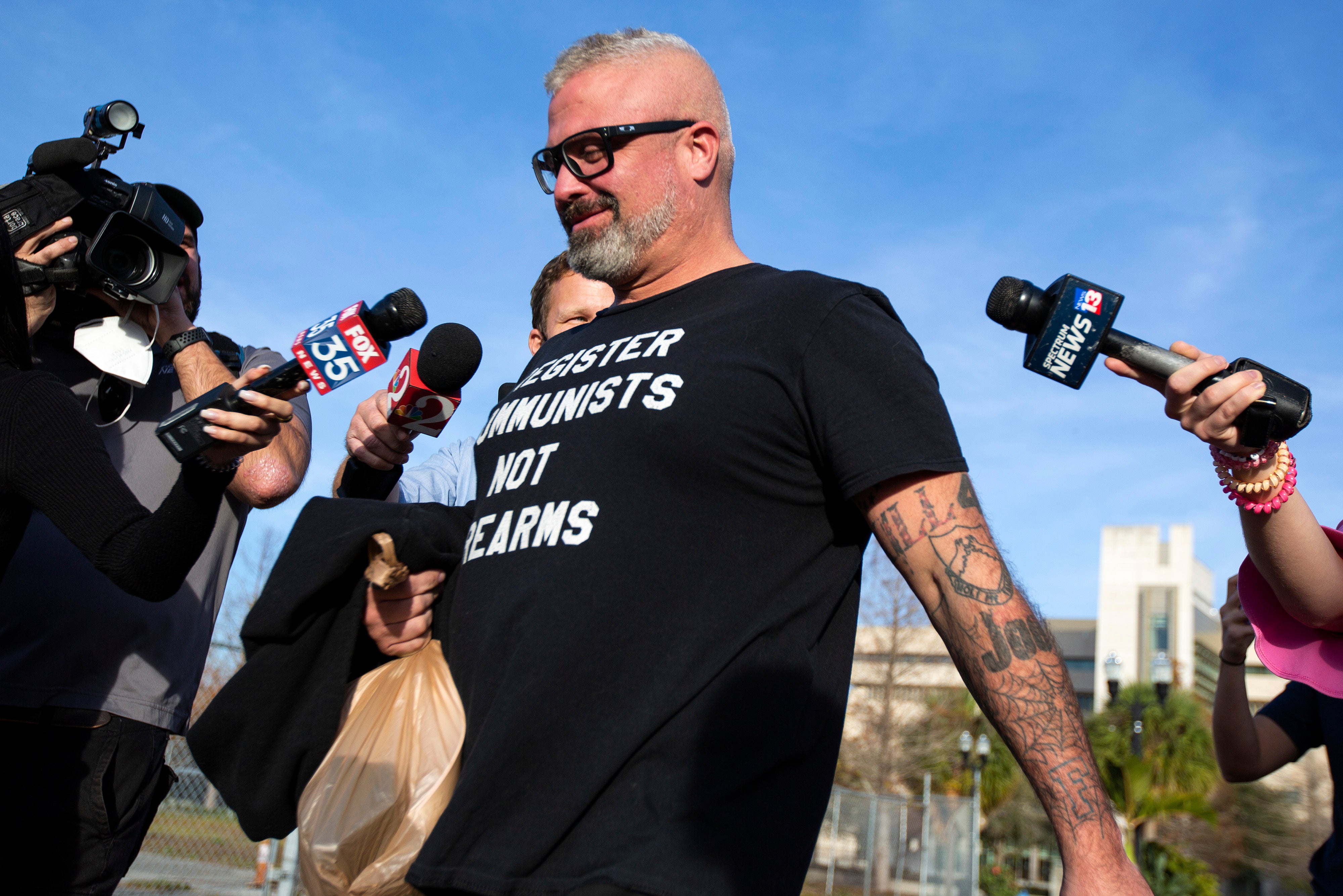 Proud Boys organizer Joseph Biggs walks from court in Orlando, Florida on January 20, 2021, after a court hearing regarding his involvement in riot at the U.S. Capitol