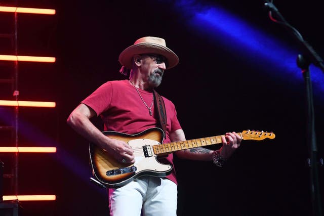 Guitarist Jack Sonni, of Dire Straits, playing in Rio de Janeiro earlier this year. The band announced Sonni has died (Alamy/PA)