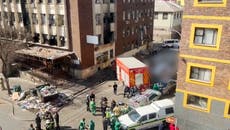 Emergency services on scene outside Johannesburg building after devastating fire kills 73