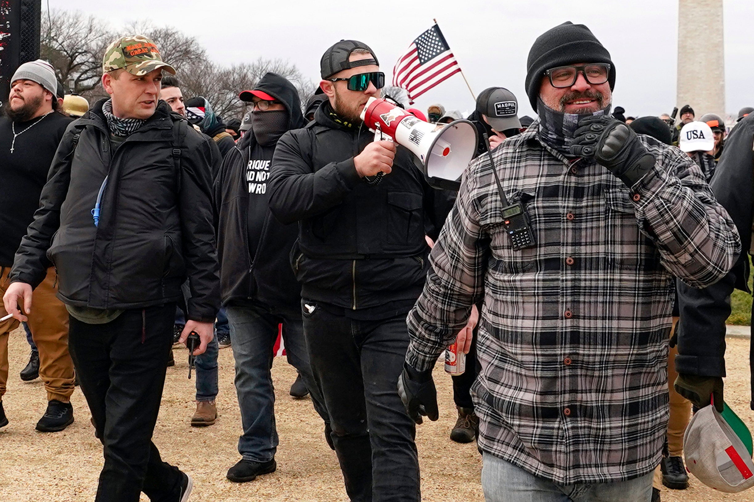 Proud Boys members Zachary Rehl, Ethan Nordean and Joe Biggs are pictured marching towards the US Capitol on 6 January, 2021.