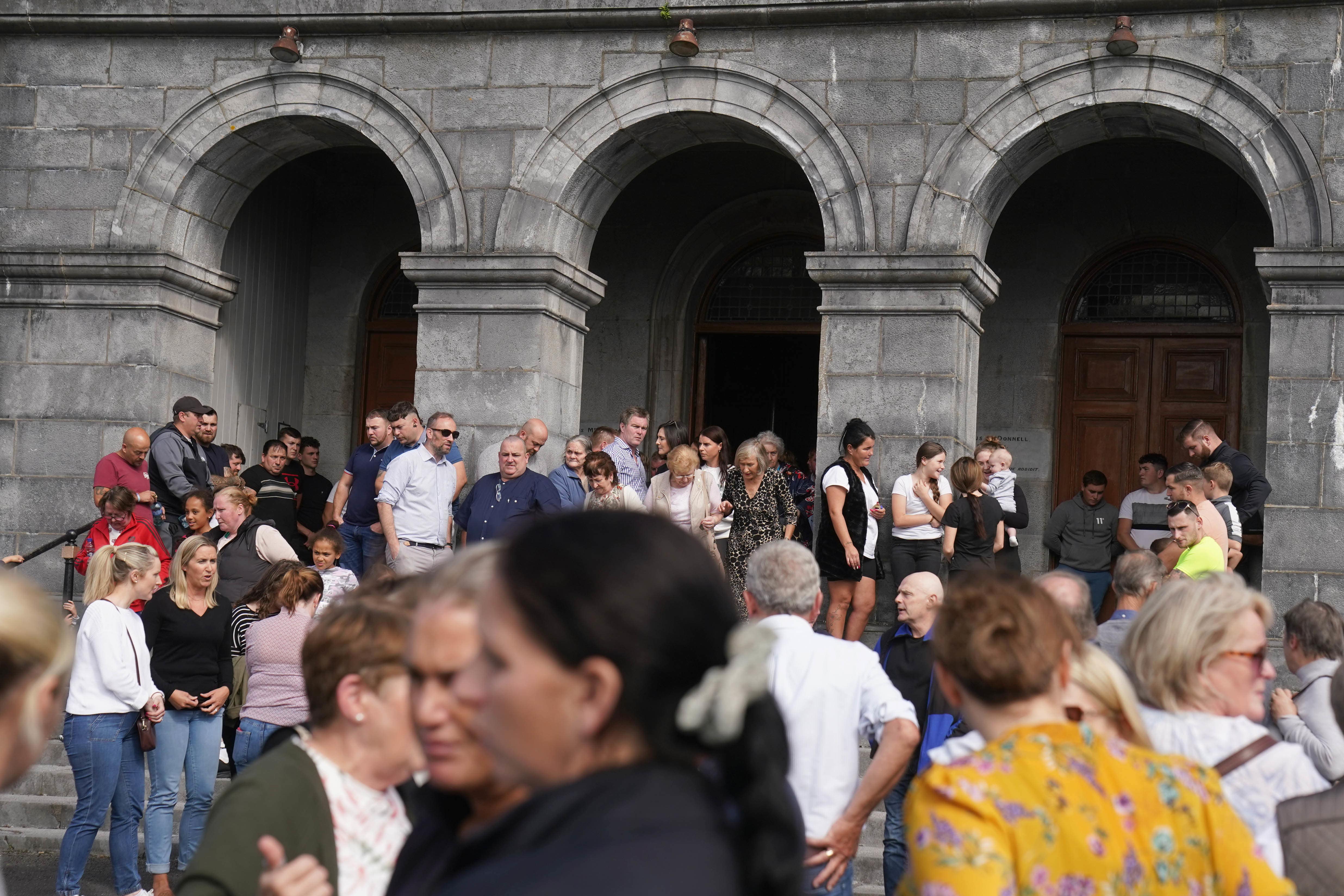 People gather outside St John the Baptist Church in Cashel following a vigil for Thomas O’Reilly, 45, his wife Bridget O’Reilly, 46, and their three-year-old grandson Tom O’Reilly, who died in a single-vehicle collision in Cashel