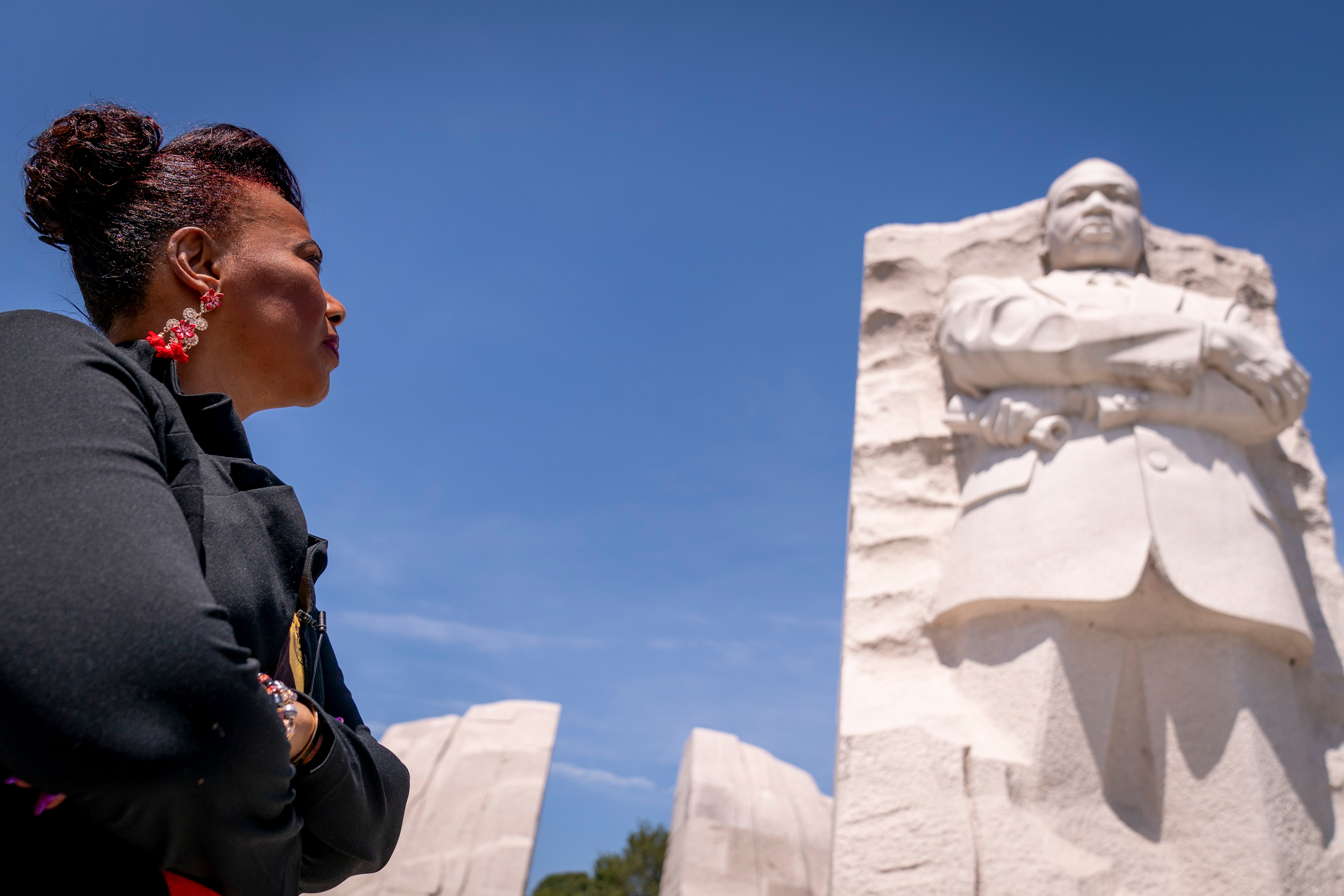 Dr Bernice King looks up at the statue of her father Dr Martin Luther King Jr