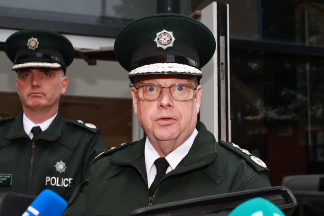 Police Service of Northern Ireland Chief Constable Simon Byrne reads a statement outside James House in Belfast after a special meeting of the Policing Board (Liam McBurney/PA)