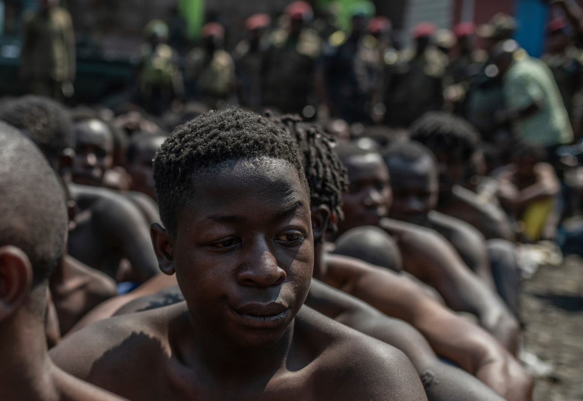 Two military officers are arrested in Congo for leading a protest crackdown that killed 43 people