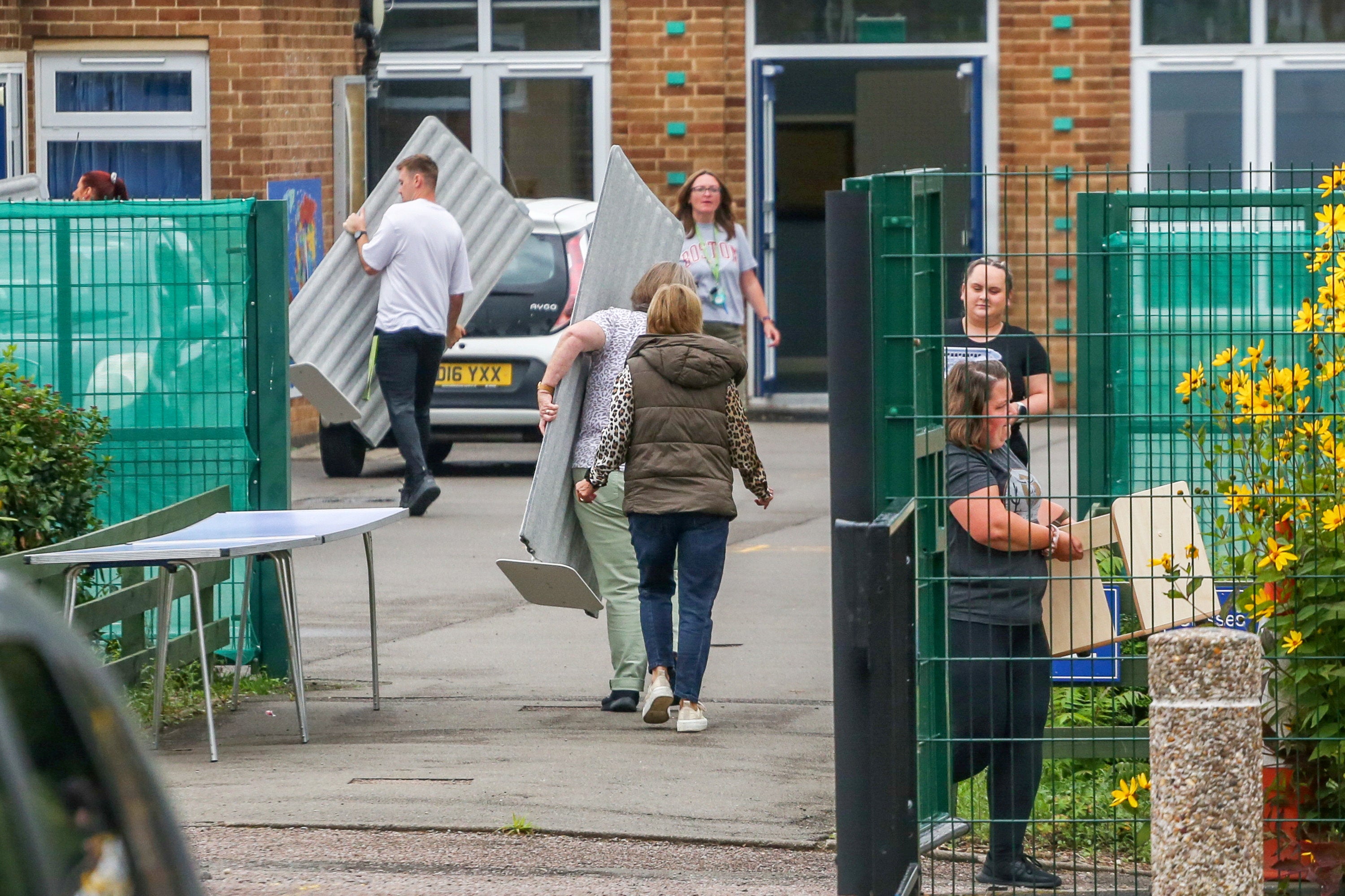 Items are cleared from Willowbrook Mead Primary Academy in Leicester, which was forced to closed over safety fears