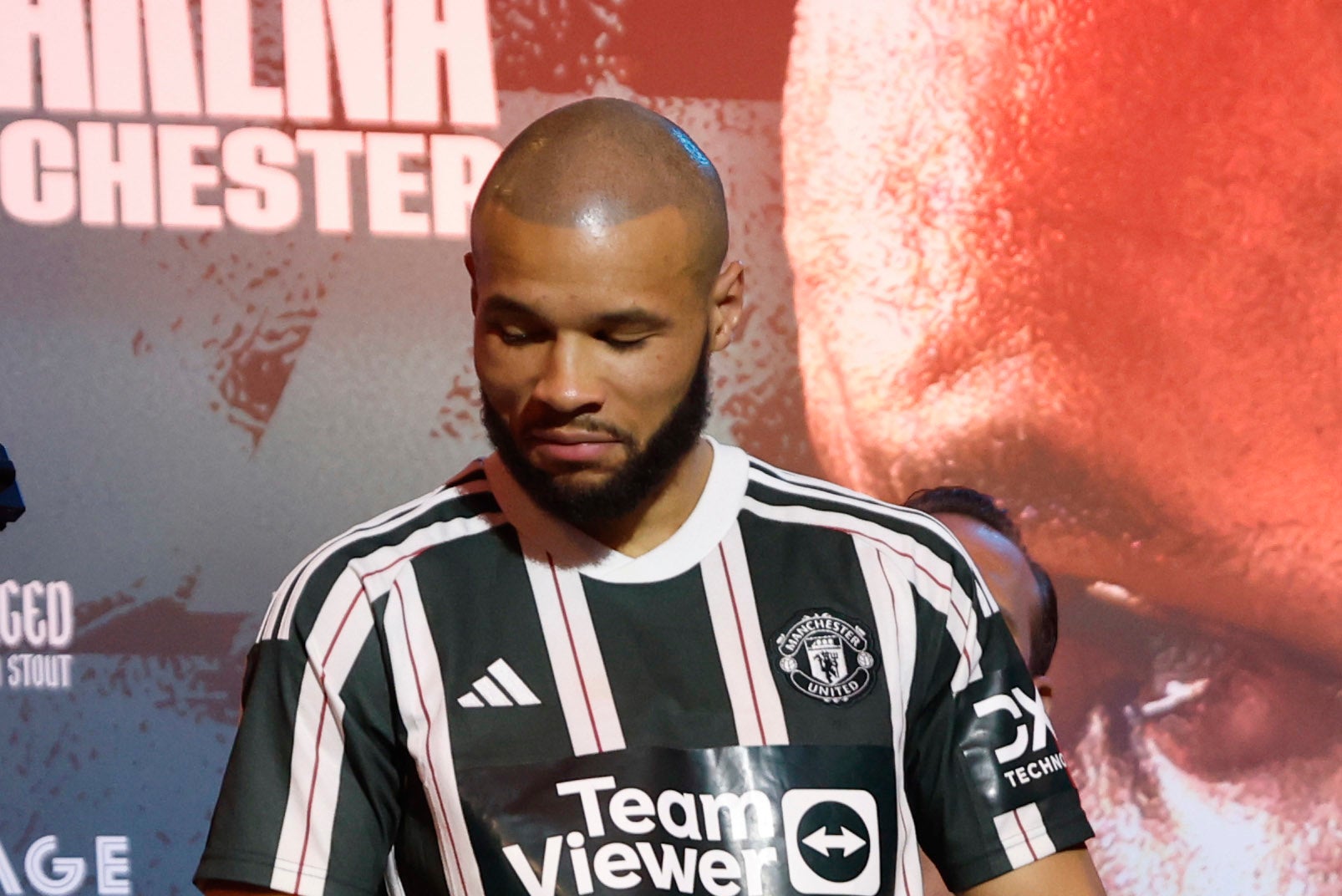 Chris Eubank Jr wears the jersey of his team Man United, taunting Liverpool fan Liam Smith