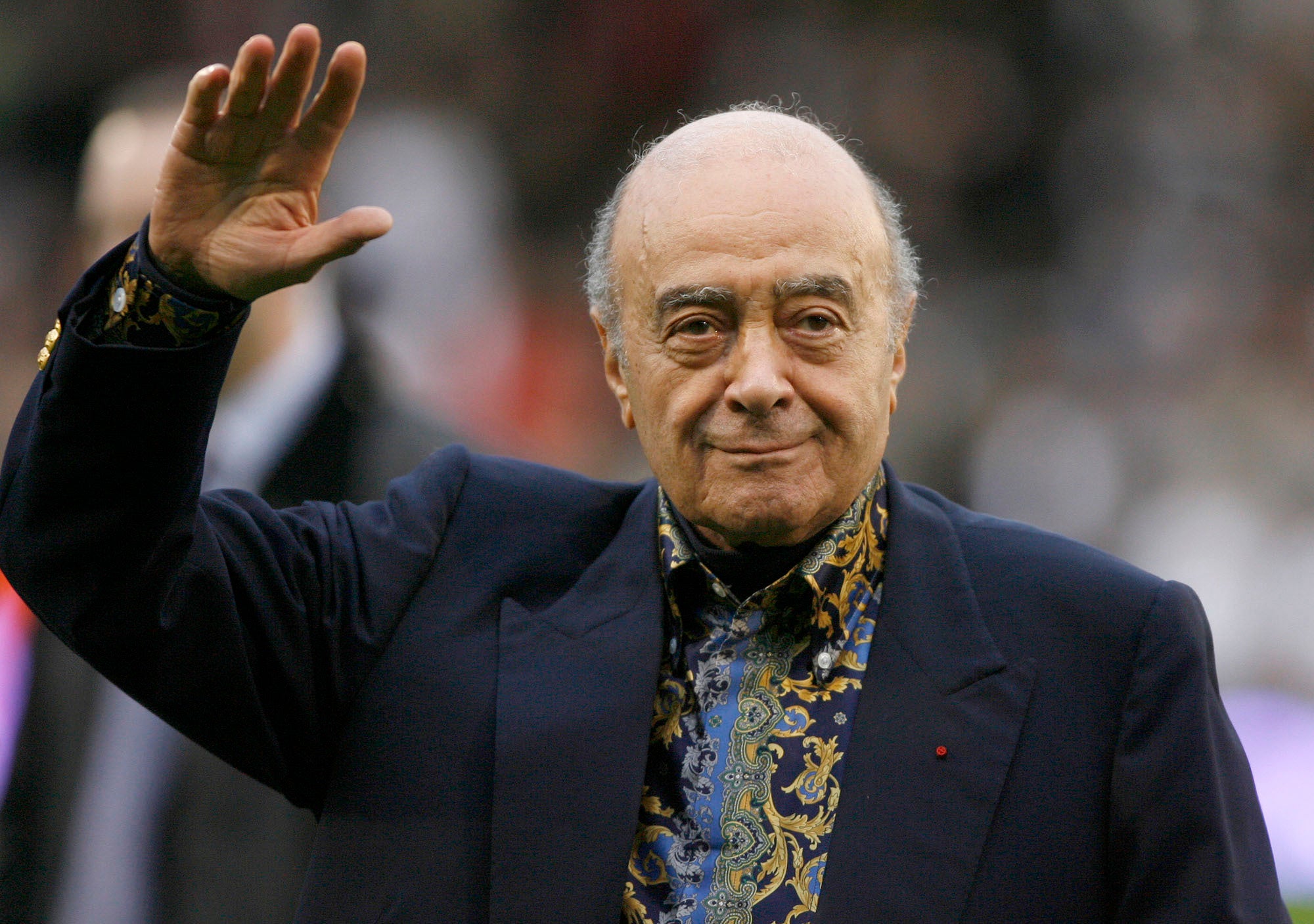 Fulham owner Mohamed Al-Fayed waves to the crowd before the English Premier League soccer match against Tottenham in 2015