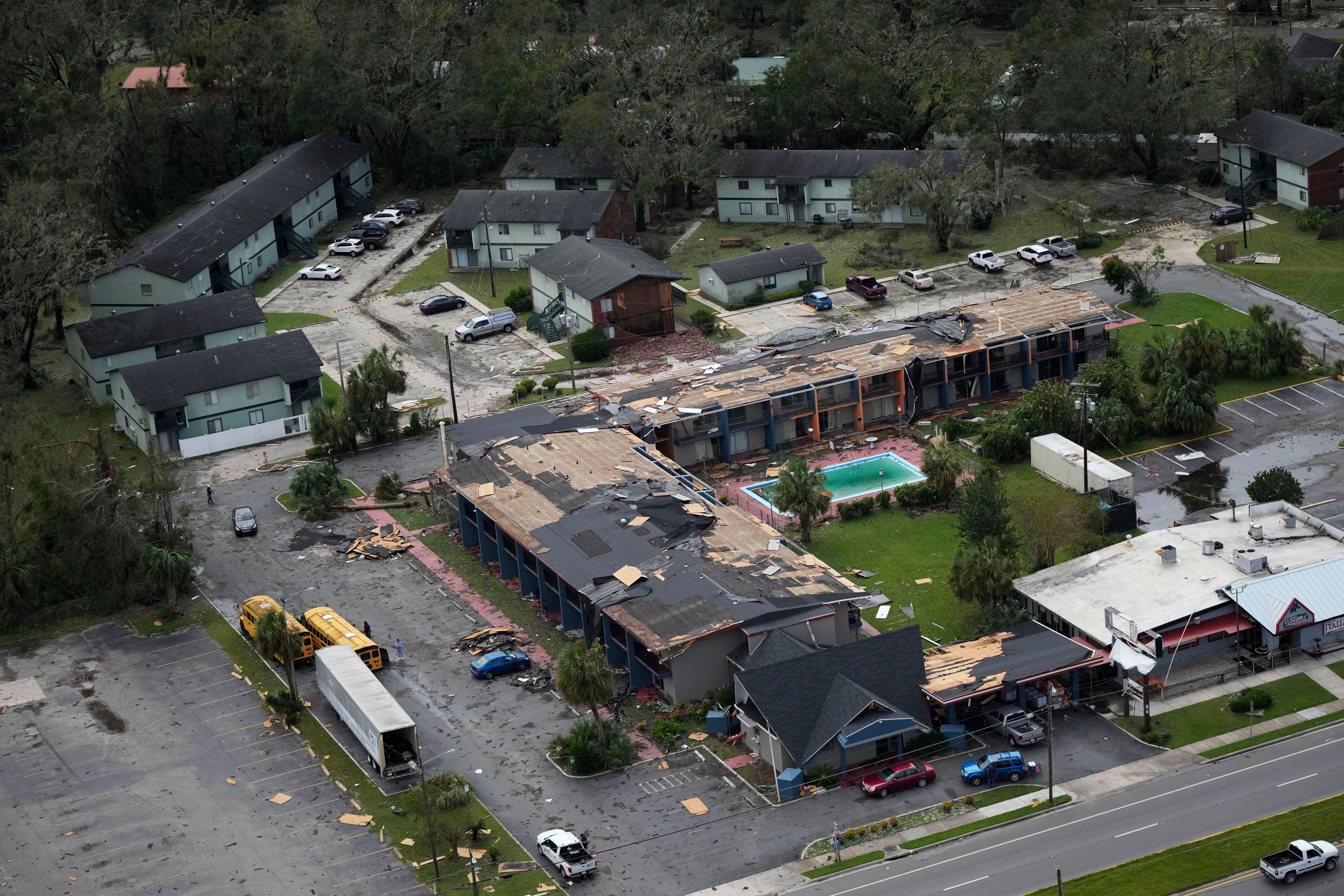 Debris is littered around the damaged Regency Inn Perry in Perry, Fla., following the passage of Hurricane Idalia, Wednesday, Aug. 30, 2023