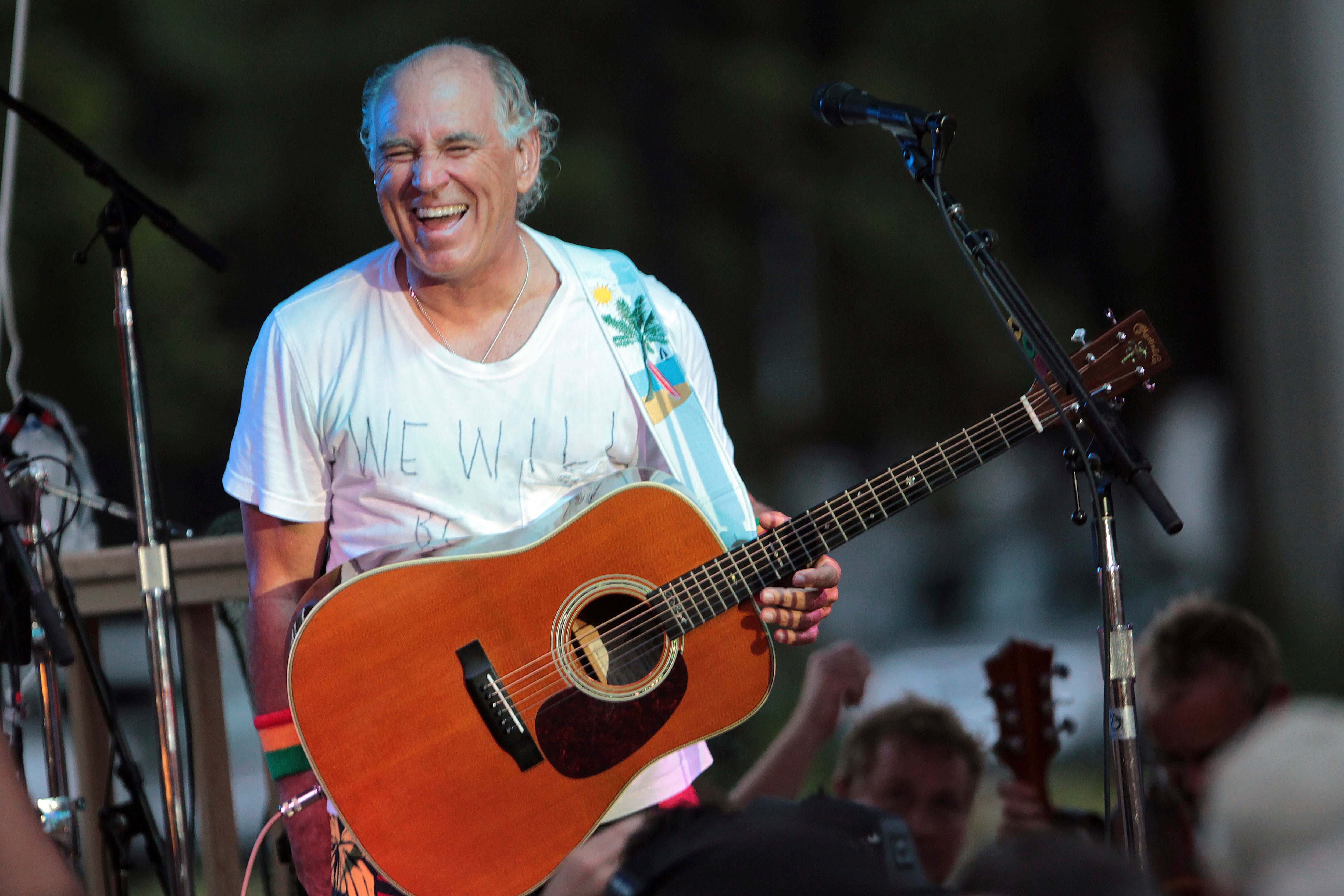 Jimmy Buffett performs at his sister’s restaurant in Gulf Shores, Alabama on June 30, 2010