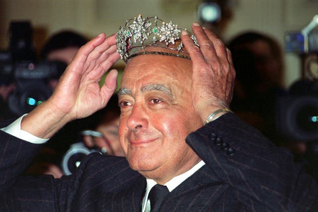 Mohamed Al Fayed donning a Victorian emerald and diamond tiara during the Harrods’ sale in 2001 (PA)