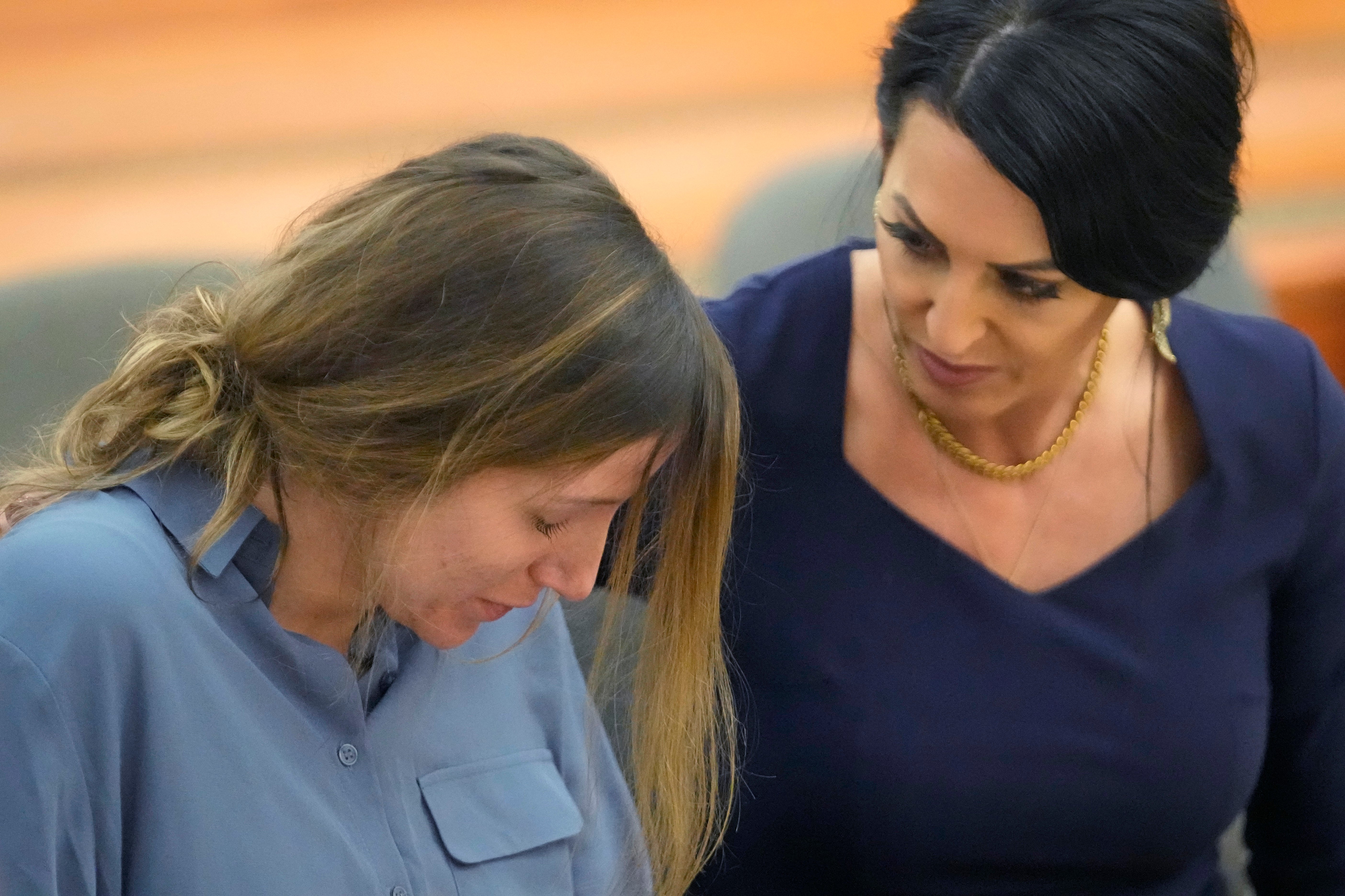 Kouri Richins is comforted by her attorney Skye Lazaro during a status hearing on Friday in Utah
