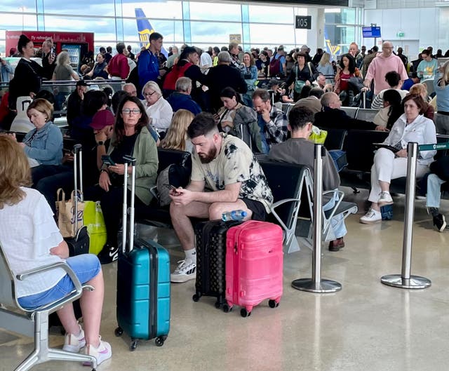 <p>Waiting game: passengers at Dublin airport waiting for UK flights on Monday 28 August 2023</p>