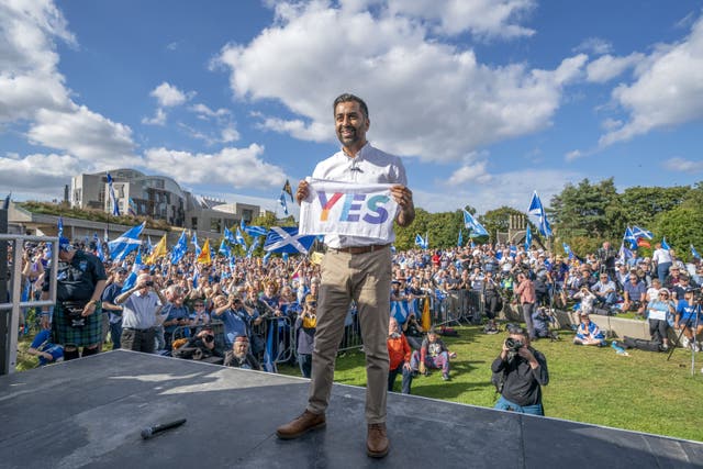 First Minister of Scotland Humza Yousaf addresses a crowd outside the Scottish Parliament following a Believe In Scotland march from Edinburgh Castle (Jane Barlow/PA)