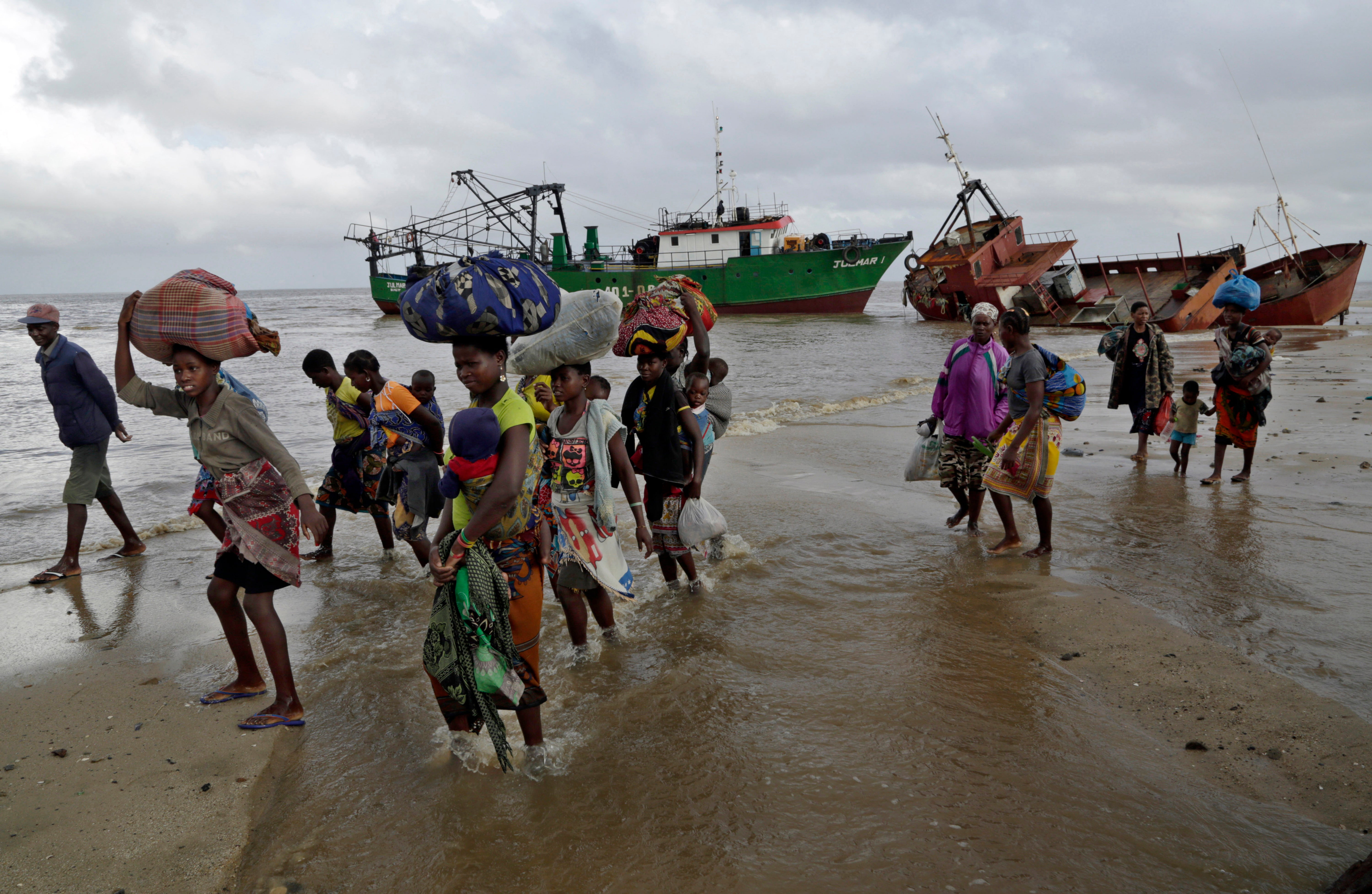 Displaced families arrive after being rescued by boat from a flooded area of Buzi district, 200 kilometers (120 miles) outside Beira, Mozambique