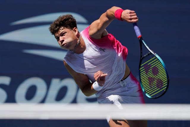 Ben Shelton serves to Tommy Paul on his way to the quarter-finals (Eduardo Munoz Alvarez/AP)