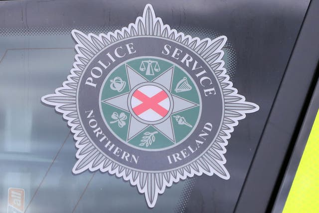 The two men were arrested in relation to a poster placed at a bus stop in Dungiven (PA)