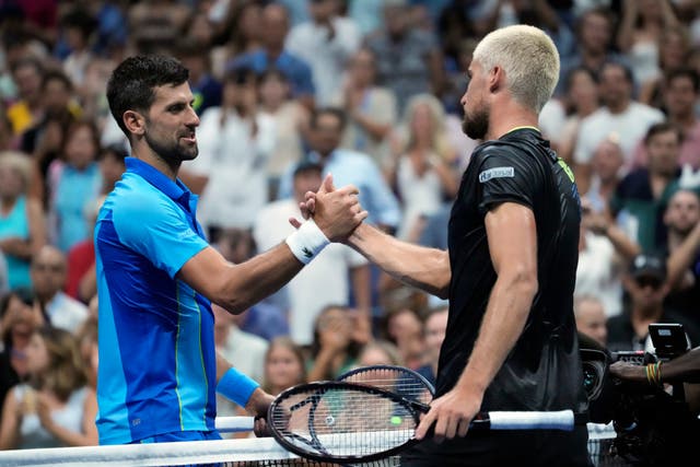Novak Djokovic shakes hands with Borna Gojo (John Minchillo/AP)