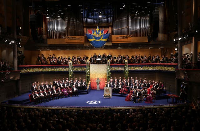 <p>Guest and laureates listen to a speech by Carl-Henrik Heldin, Chairman of the Board of the Nobel Foundation during the 2015 Nobel prize award ceremony at the Stockholm Concert Hall on 10 December 2015</p>