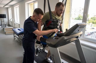 Mykhailo Yurchuk, a former Ukrainian paratrooper of the 95th brigade, learns to run on his prosthetic leg at the Unbroken rehabilitation center in Lviv