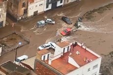 Spain floods: Cars washed away by torrential rain in aerial footage