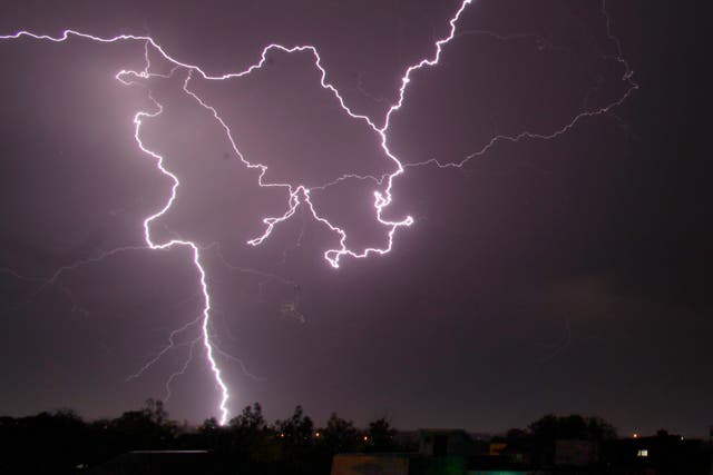 <p>File: A bolt of lightning strikes in the horizon in India</p>