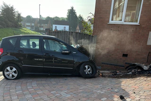 The car collided with a house in Beckbury Road after hitting three people in Coventry on Sunday (Barry Dean/PA)