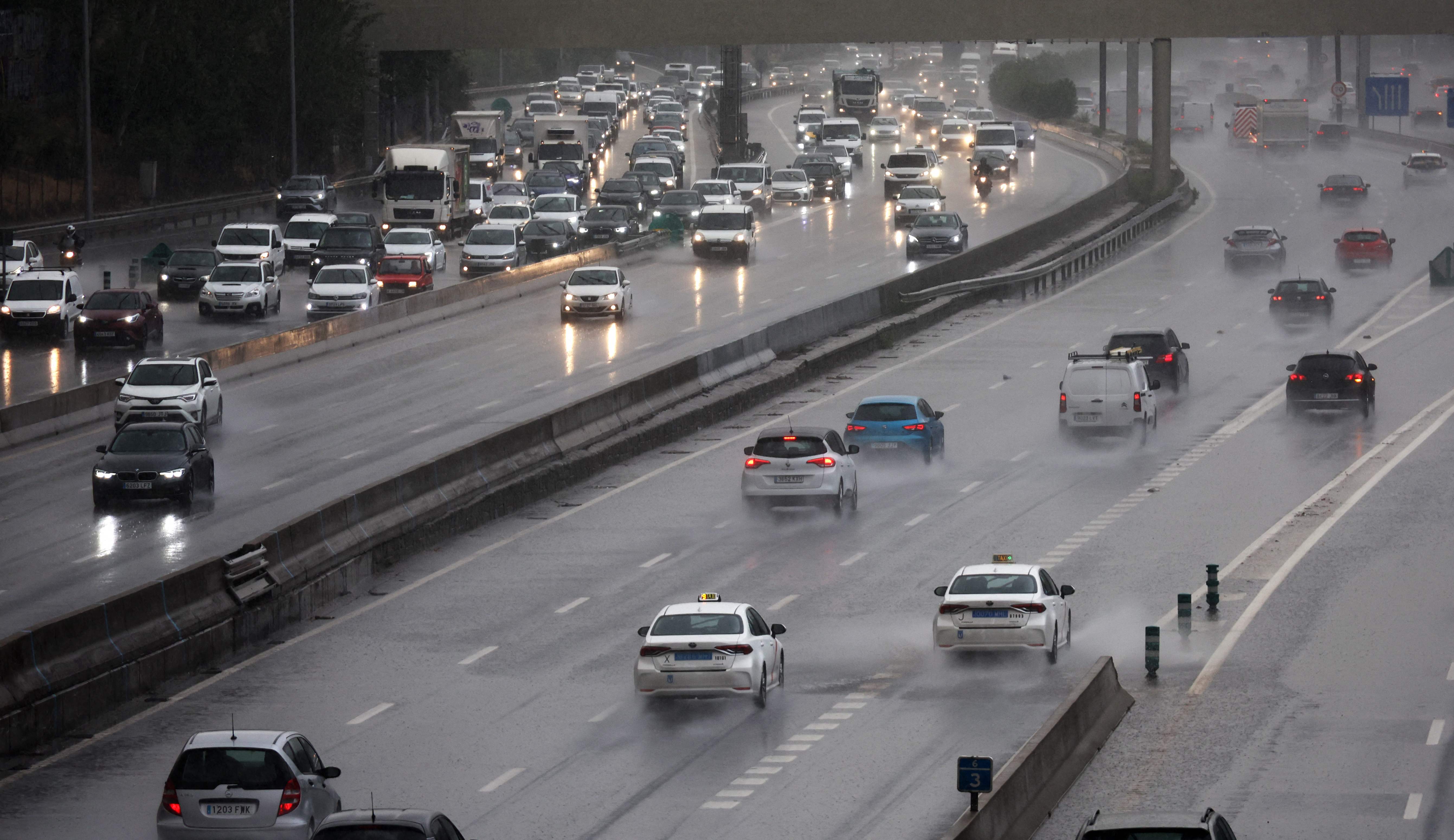 Cars in the rain on the M-30 highway in Madrid on Monday