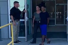 Moment alleged teen killer smiles at camera after double murder arrest