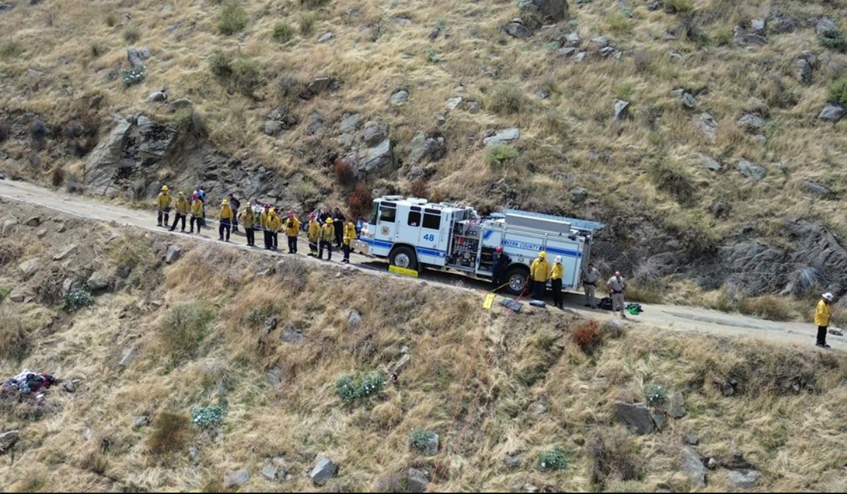 Rescue workers from the Kern County Fire Department rescued a driver on Saturday whose truck plunged from a 100-foot ravine five days earlier