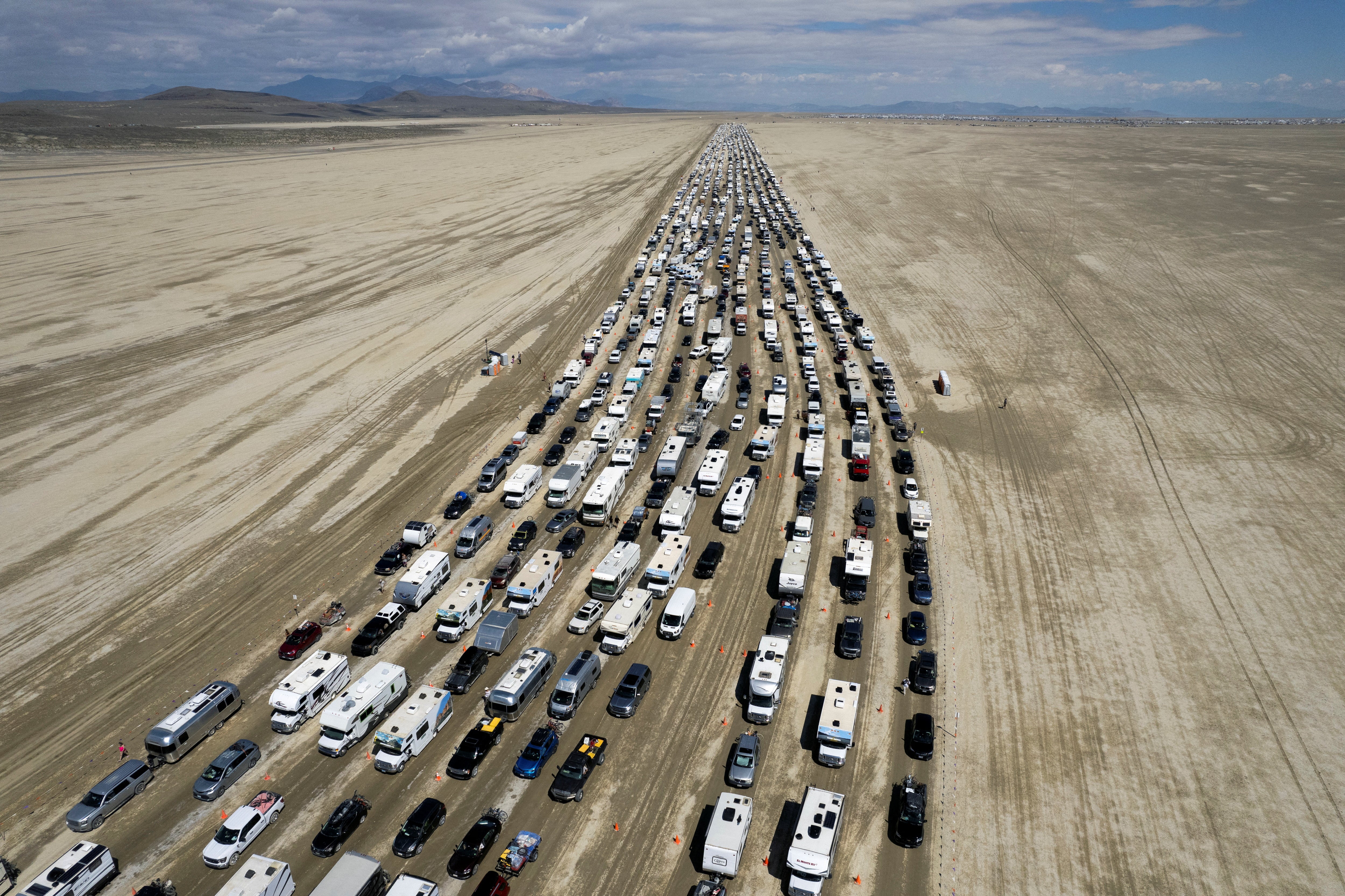 Vehicles are seen departing the Burning Man festival in Black Rock City, Nevada