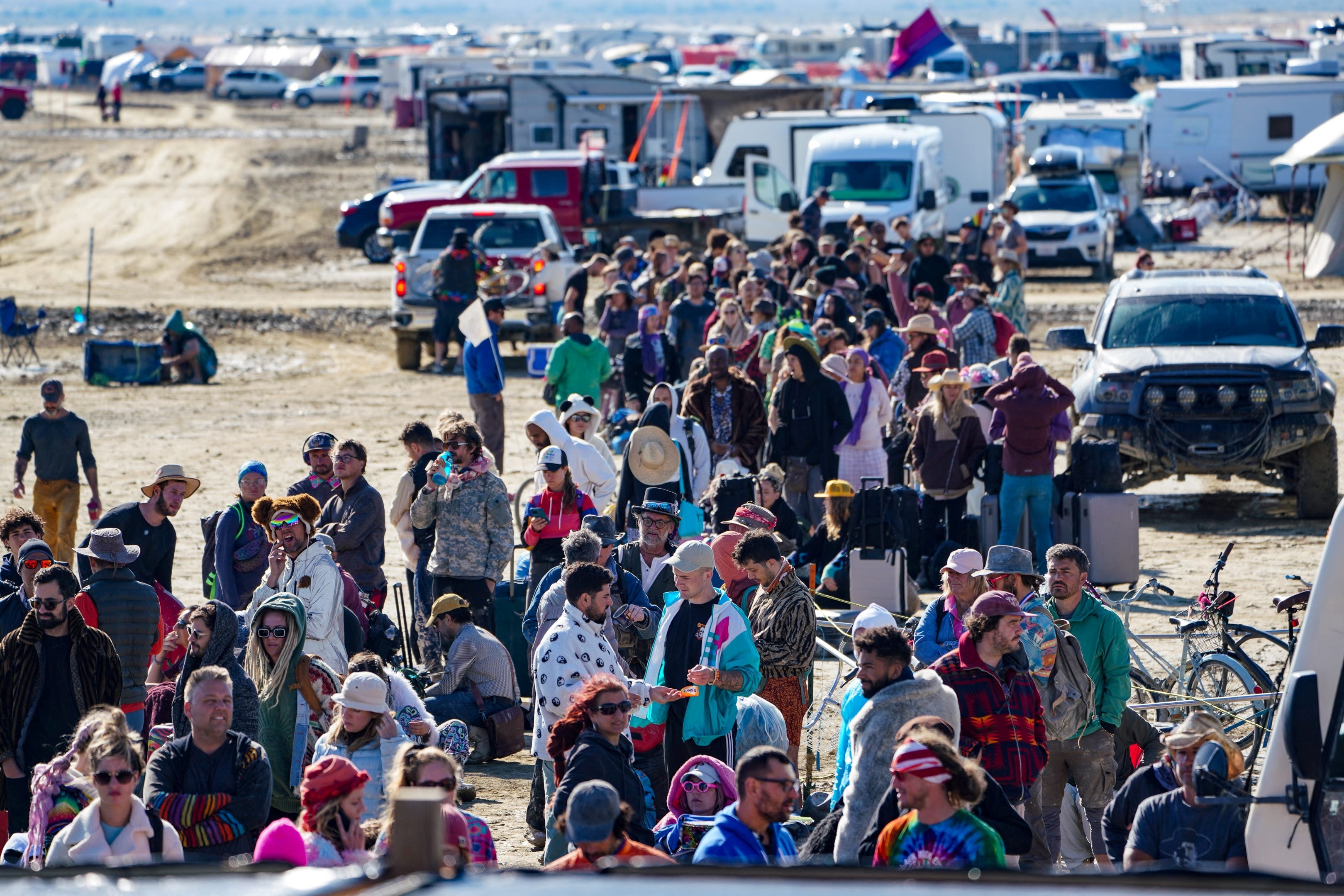 Hundreds of Burning Man attendees who planned to leave on buses wait for information