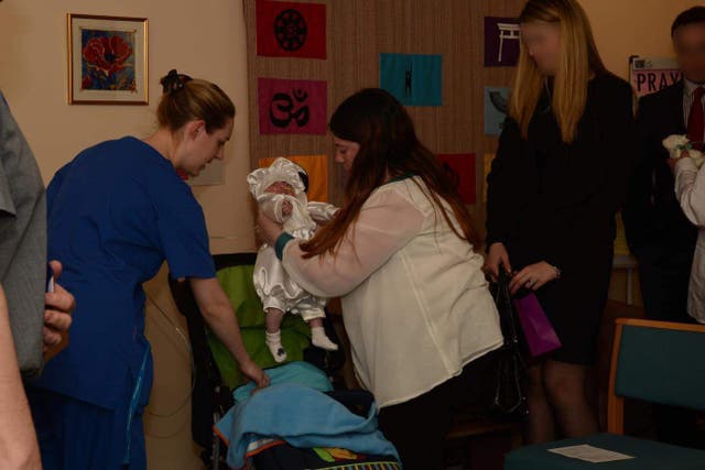 <p>Lucy Letby with mum Emily Morris, stepdad Mark Lewis and baby Alvin. </p>