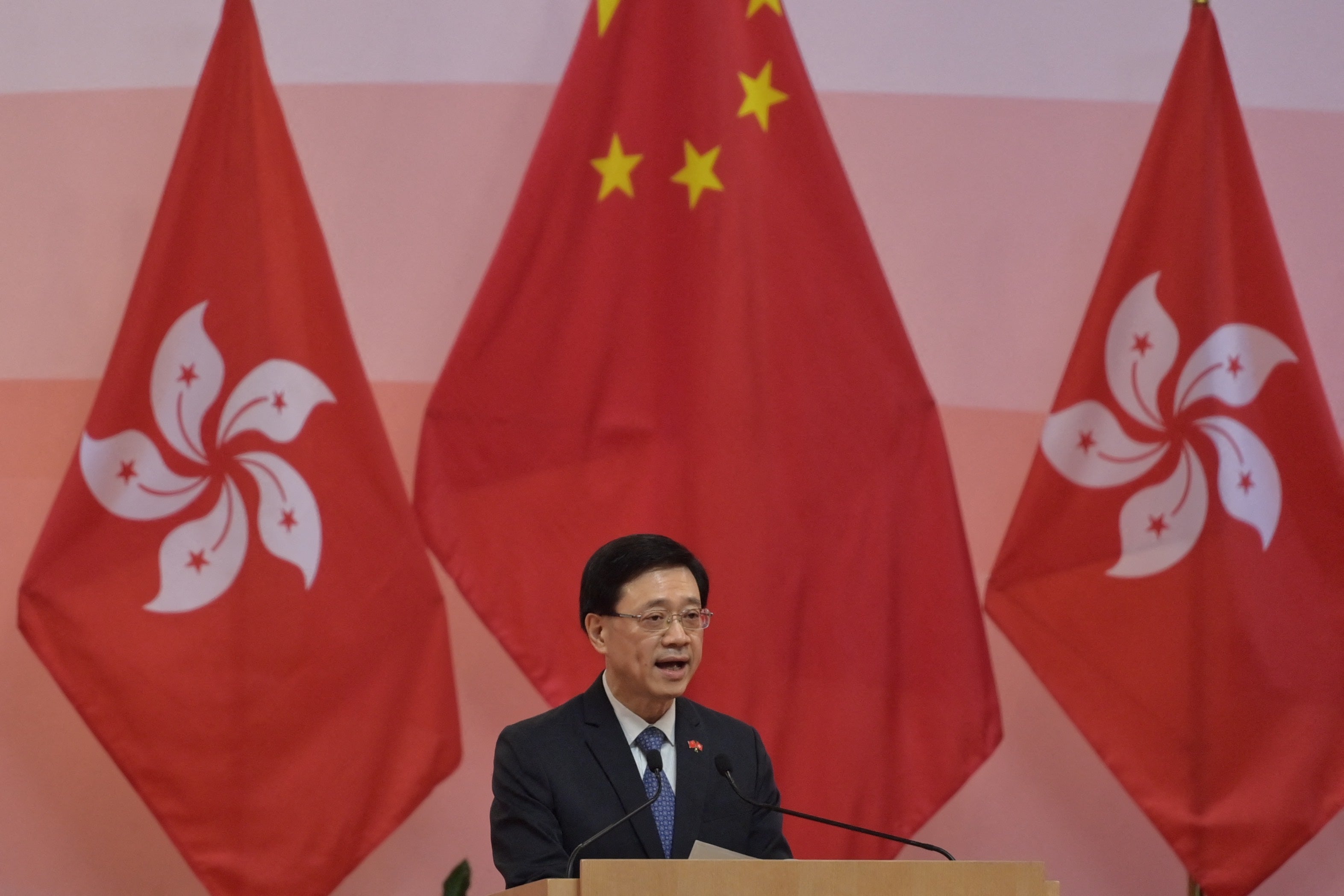 File: Hong Kong leader John Lee speaks during a flag-raising ceremony